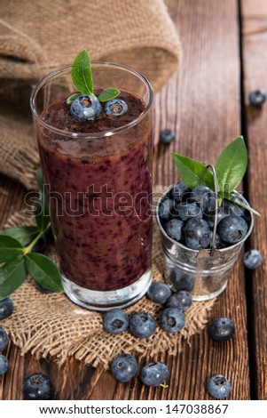 Healthy Blueberry Shake on wooden background