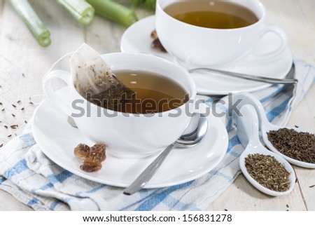 Fennel Tea (macro shot) on a white wooden table