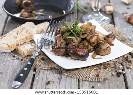 Plate with Fried Mushrooms and fresh herbs