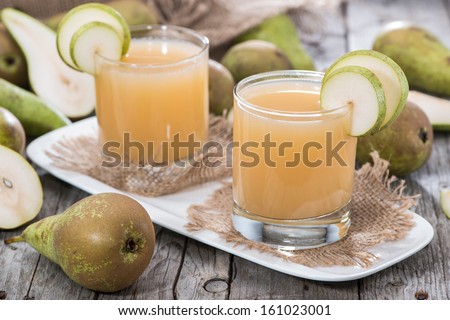 Glass filled with freh made Pear Juice
