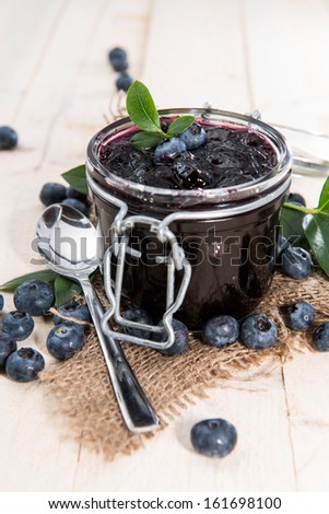 Blueberry Jam in a glass with fresh fruits