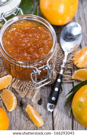 Fresh Tangerine Jam on vintage background
