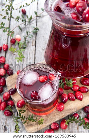 Glass with Cranberry Juice and Ice Cubes
