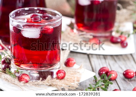 Cranberry Juice in a glass with fresh fruits