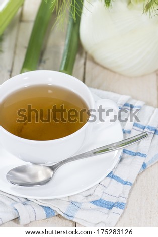 Fennel Tea (macro shot) on a white wooden table