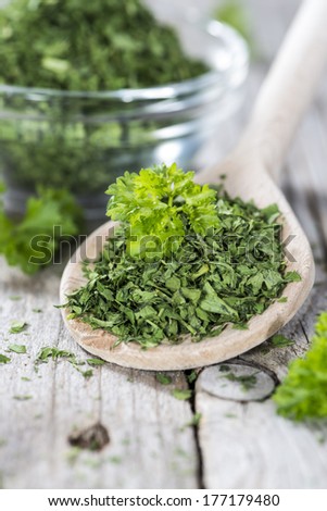 Portion of fresh dried Parsley (close-up shot)