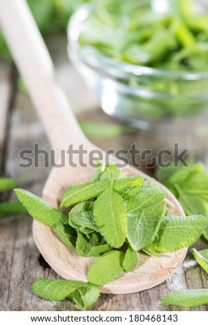 Small portion of fresh Sage on a wooden spoon