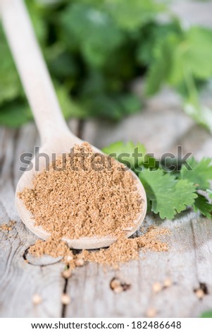 Small Portion of Coriander Powder on a wooden spoon