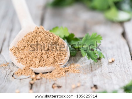 Small Portion of Coriander Powder on a wooden spoon