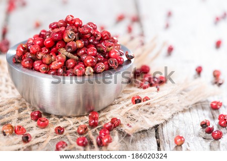 Small bowl with Pink Peppercorns (detailed macro shot)