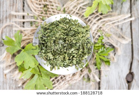 Heap of dried flat leaf Parsley (detailed close-up shot)