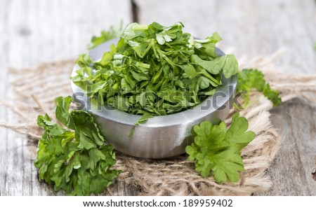 Portion of fresh cutted herbs (Parsley) in a small bowl