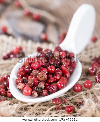 Portion of dried Pink Peppercorns (detailed close-up shot)