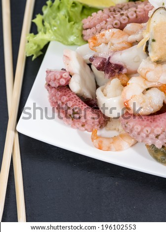 Mixed Seafood Salad with squid, mussels and shrimps (detailed studio shot)