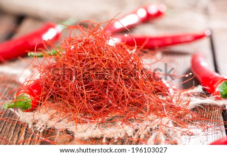 Small portion of dried Chilli Strings on wooden background