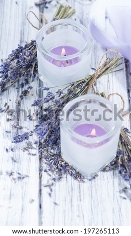 Lavender Candles in small glasses with some dried plants