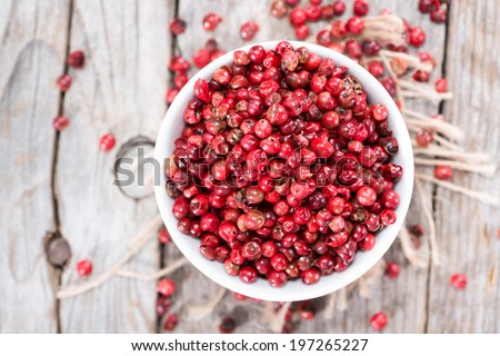 Small portion of dried Pink Peppercorns (close-up shot)