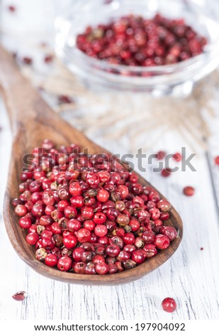 Small portion of dried Pink Peppercorns (close-up shot)