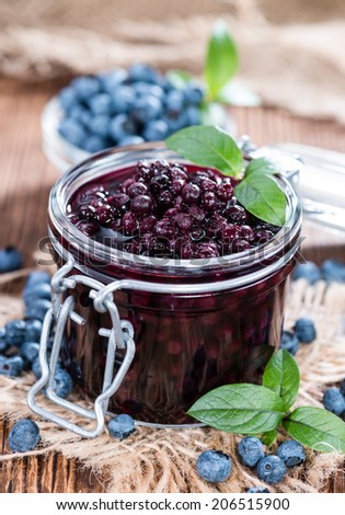 Portion of canned Blueberries with some fresh fruits
