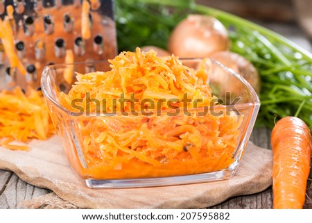 Carrot Salad (close-up shot) on weathered wooden background