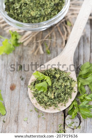 Heap of dried flat leaf Parsley (detailed close-up shot)