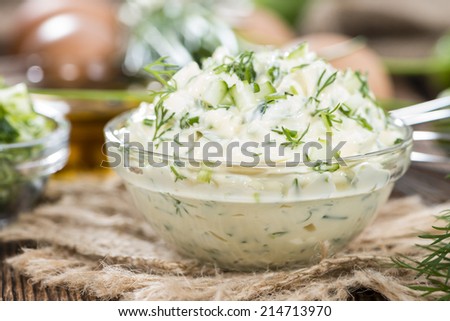 Fresh made Sauce Remoulade (close-up shot) on wooden background