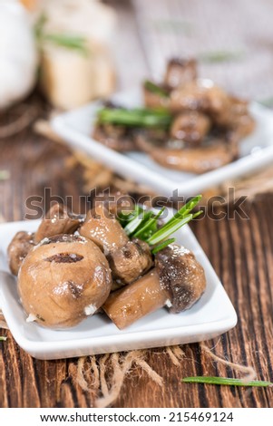 Tapas (Mushrooms) marinated with olive oil and some fresh herbs