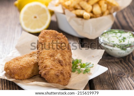 Portion of Fried Salmon with Chips and homemade remoulade
