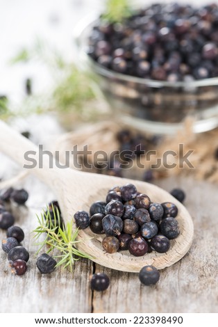 Portion of Juniper Berries on vintage wooden background