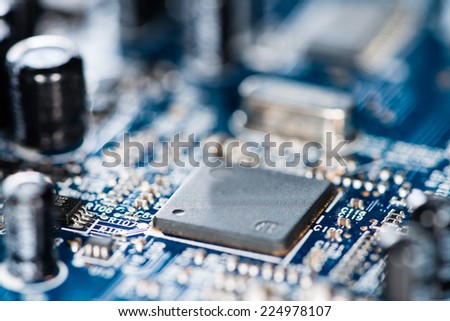 Chips on a blue PCB (detailed close-up shot)