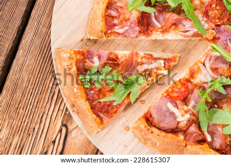 Homemade Ham Pizza (with rocket, fresh tomatoes, garlic and cheese)