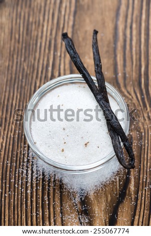 White Vanilla Sugar on rustic wooden background