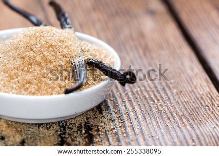 Vanilla Sugar (Brown) on wooden background (close-up shot)