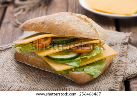 Cheddar Cheese Sandwich (detailed close-up shot) on wooden background