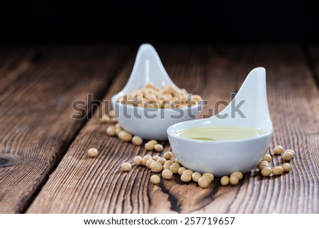 Healthy Soy Oil on dark rustic wooden background