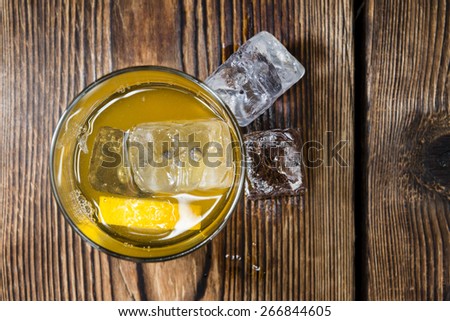 Fresh made Cocktail (Whiskey Sour) on dark wooden background