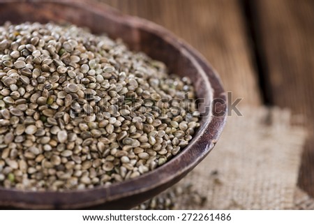 Hemp Seeds (close-up shot) on an old wooden table