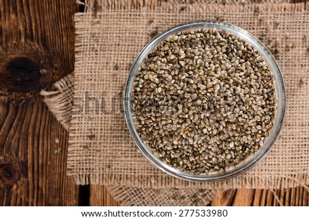 Heap of Hemp Seeds on wooden background (cloese-up shot)