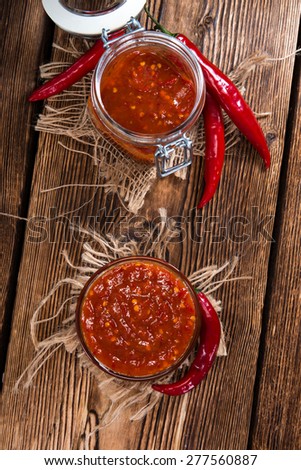Portion of Chili Sauce (Sambal Oelek) on rustic wood