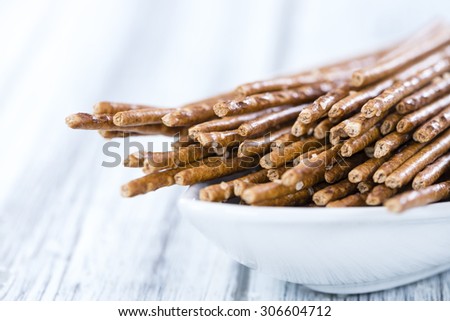 Salt Sticks (close-up shot) on bright wooden background