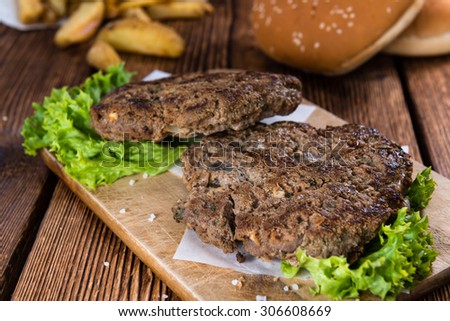 Fresh made Burger Meat on vintage wooden background