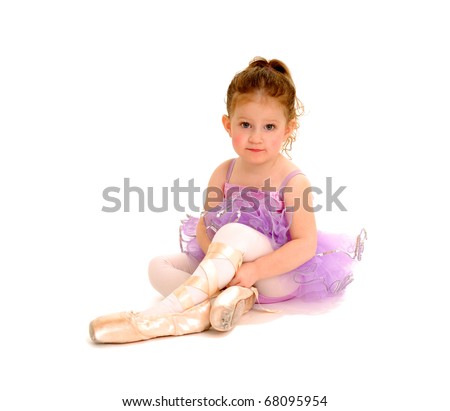 tiny ballerina tries on pointe shoes