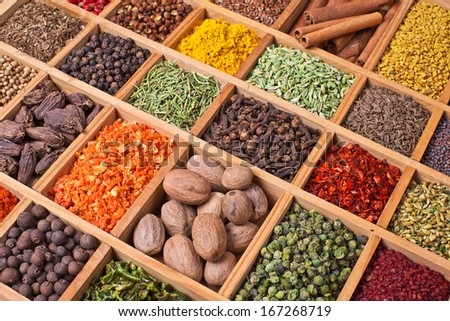 wooden box with spices and herbs