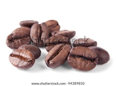 Coffee beans in closeup isolated on white background