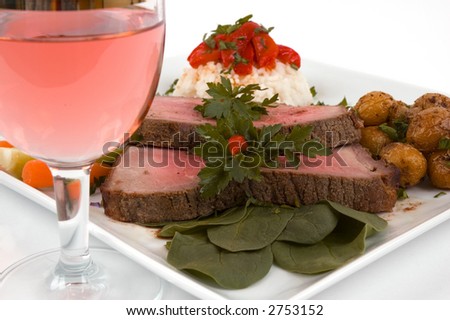 Roast beef, wine, rice, organic vegetables and baby potatoes