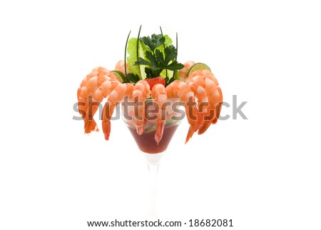 Gourmet large shrimp cocktail with cocktail sauce, lime, lettuce, parsley and chives