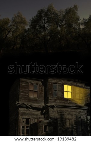 Light coming out from abandoned old home during night time