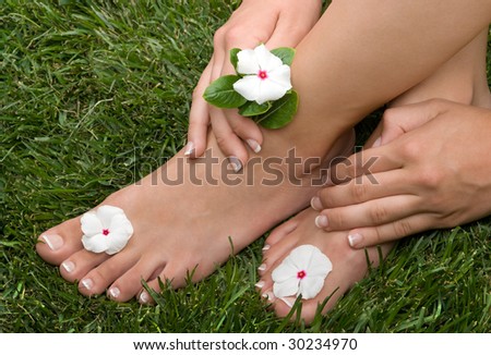 Pedicured feet on grass
