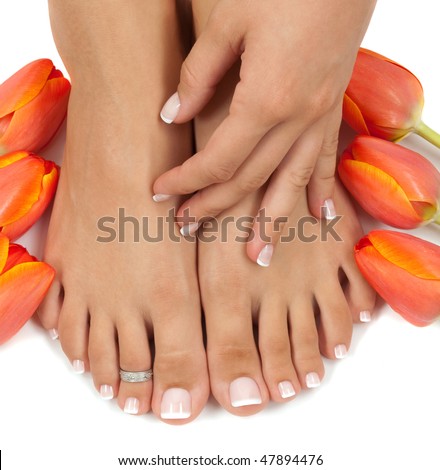 Elegant tulips manicured hand and pedicured feet