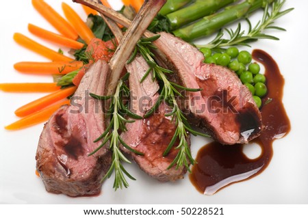 Gourmet lamb chop with vegetables, herbs and balsamic vinegar